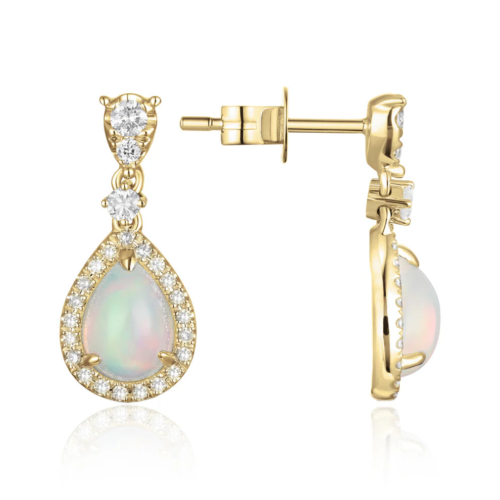 Opal Earrings in a dangle design with a diamond halo. Timeless and effortless beauty.