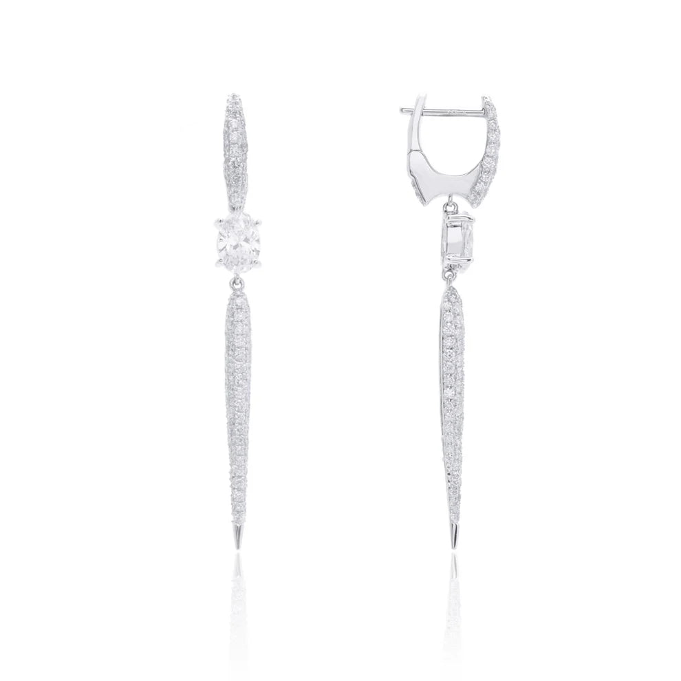 Gold diamond earrings features a bold oval bar. A Center stone and drop design to captivate.