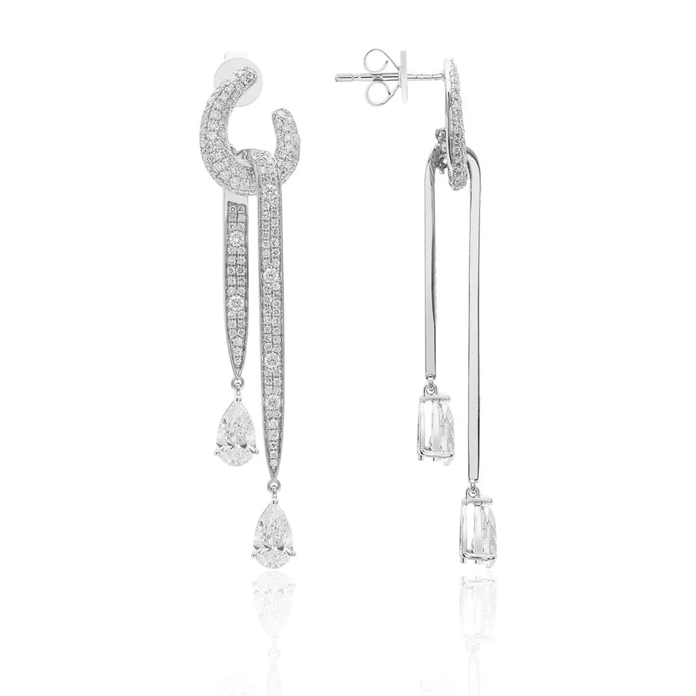Bold diamond dangle earrings embellished with pear shaped diamonds and other pavé diamonds.