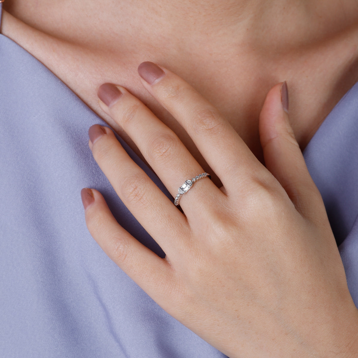 14k Baguette Twist Diamond Ring with baguette cut diamond and a twist design that has diamonds.