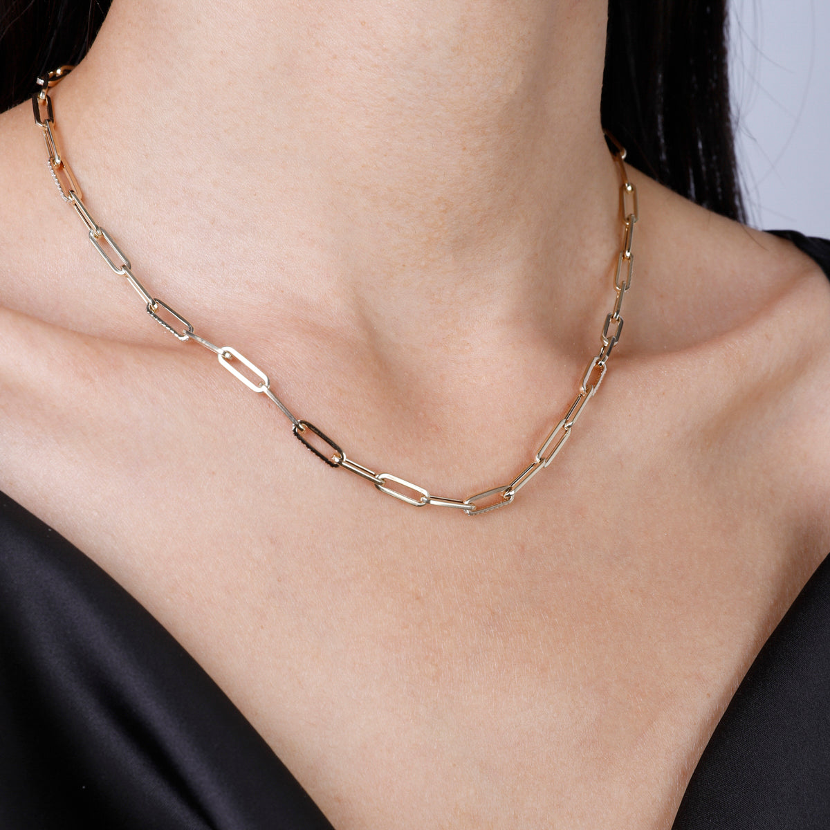 Diamond chain necklace features strand of round diamonds, set in row down center of a classic chain