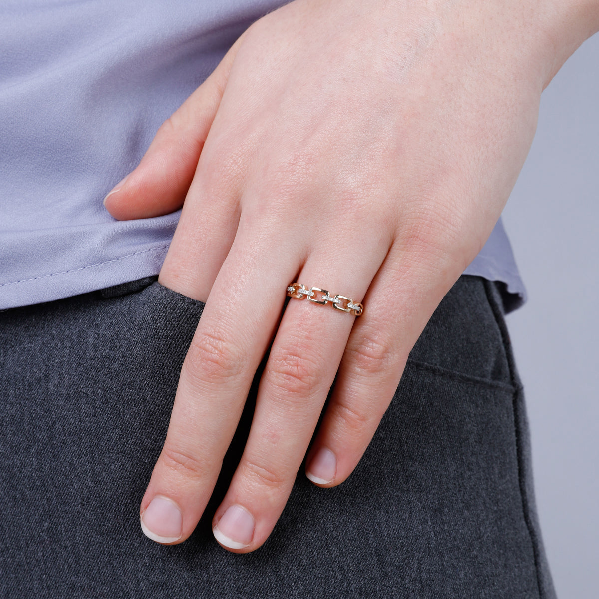 Stunning round cut diamond pave around an interlinked chain ring. Timeless beauty for everyday