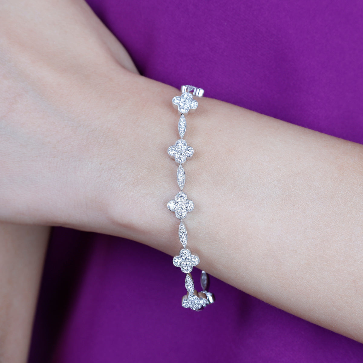 Clover link bracelet with dazzling diamonds in each inspired clover. Link design for timeless allure
