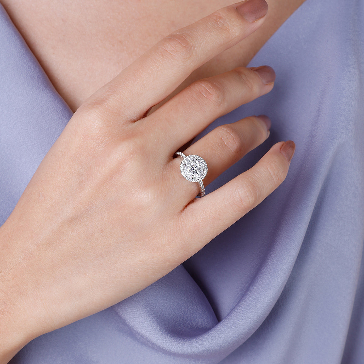 Diamond cluster ring, round halo setting encases a sparkling array of lustrous diamonds