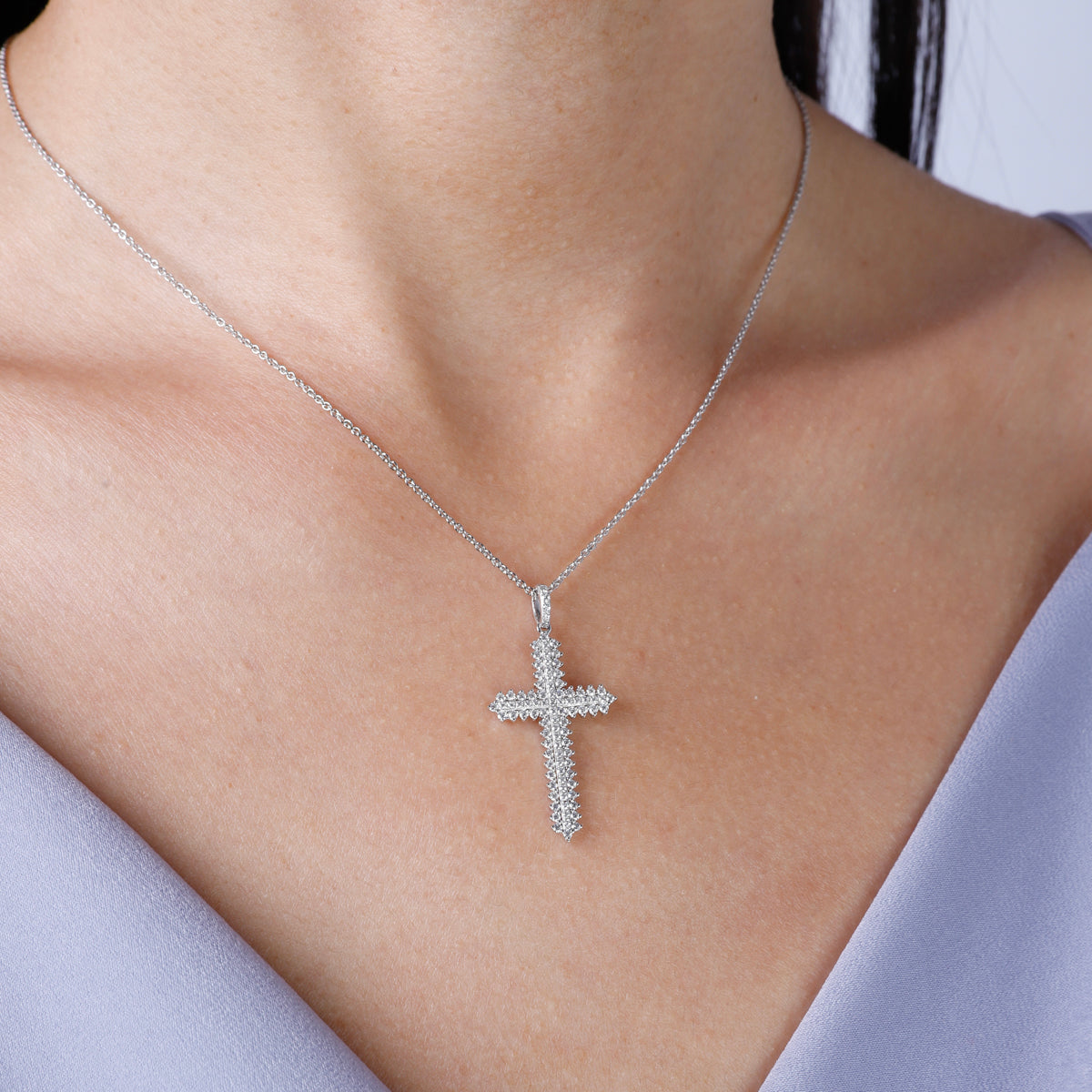 Beaded Cross Necklace has an array of diamonds along with its beaded design making it stand out. 