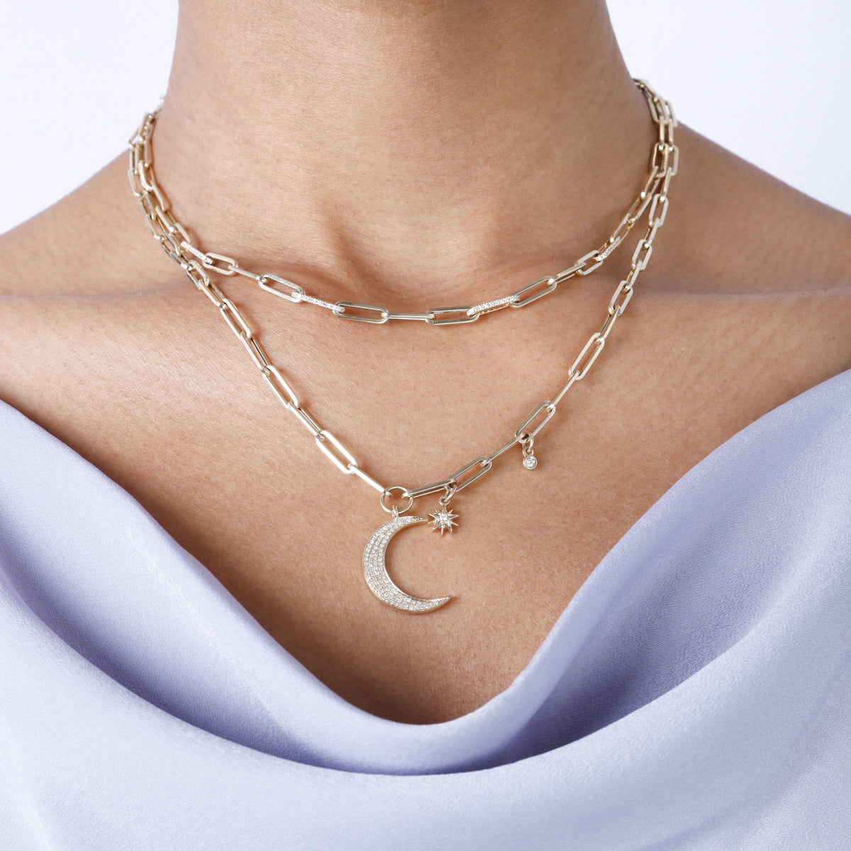 Diamond chain necklace features strand of round diamonds, set in row down center of a classic chain