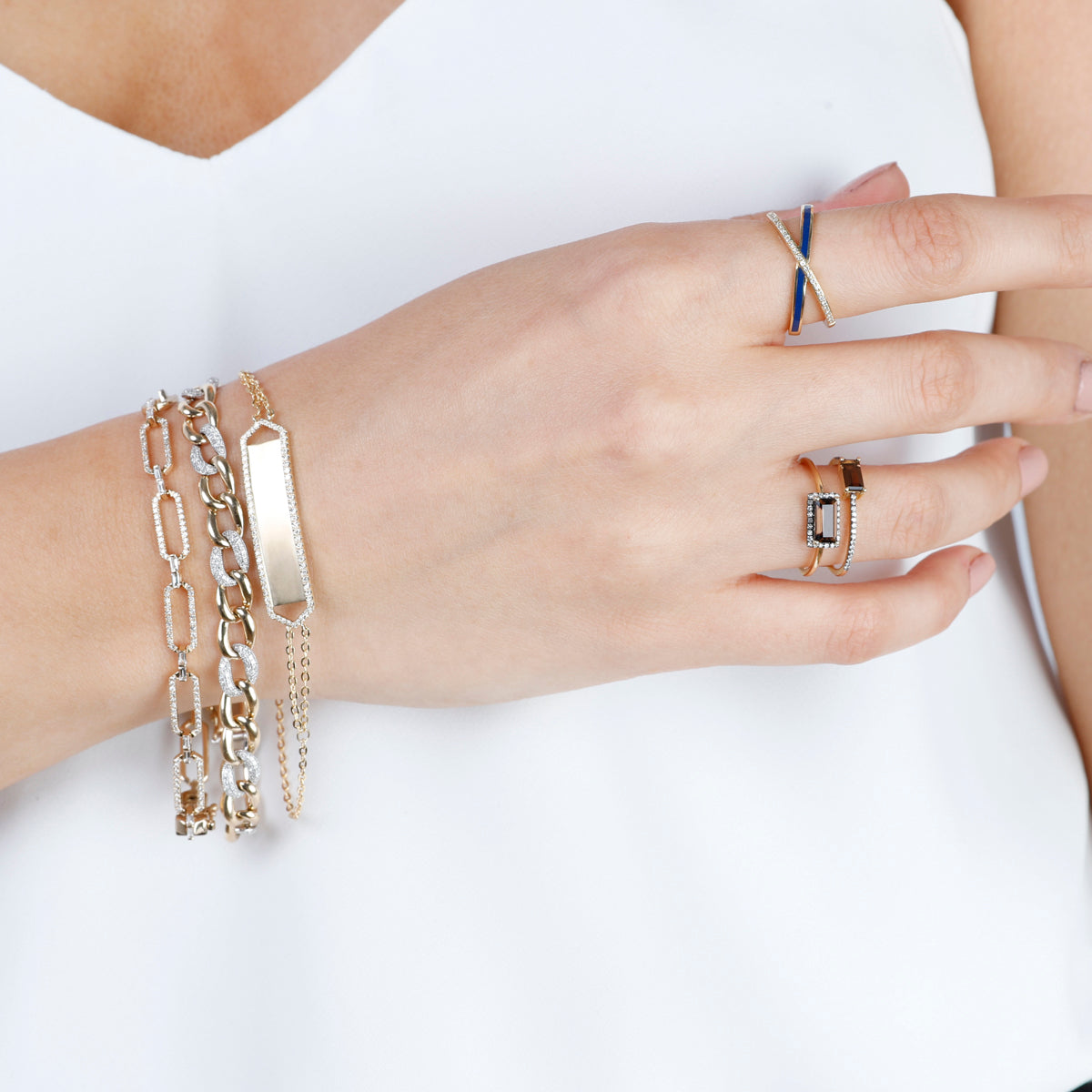 Gold chain bracelet with blend of shimmering diamond pavéd links and polished white gold.