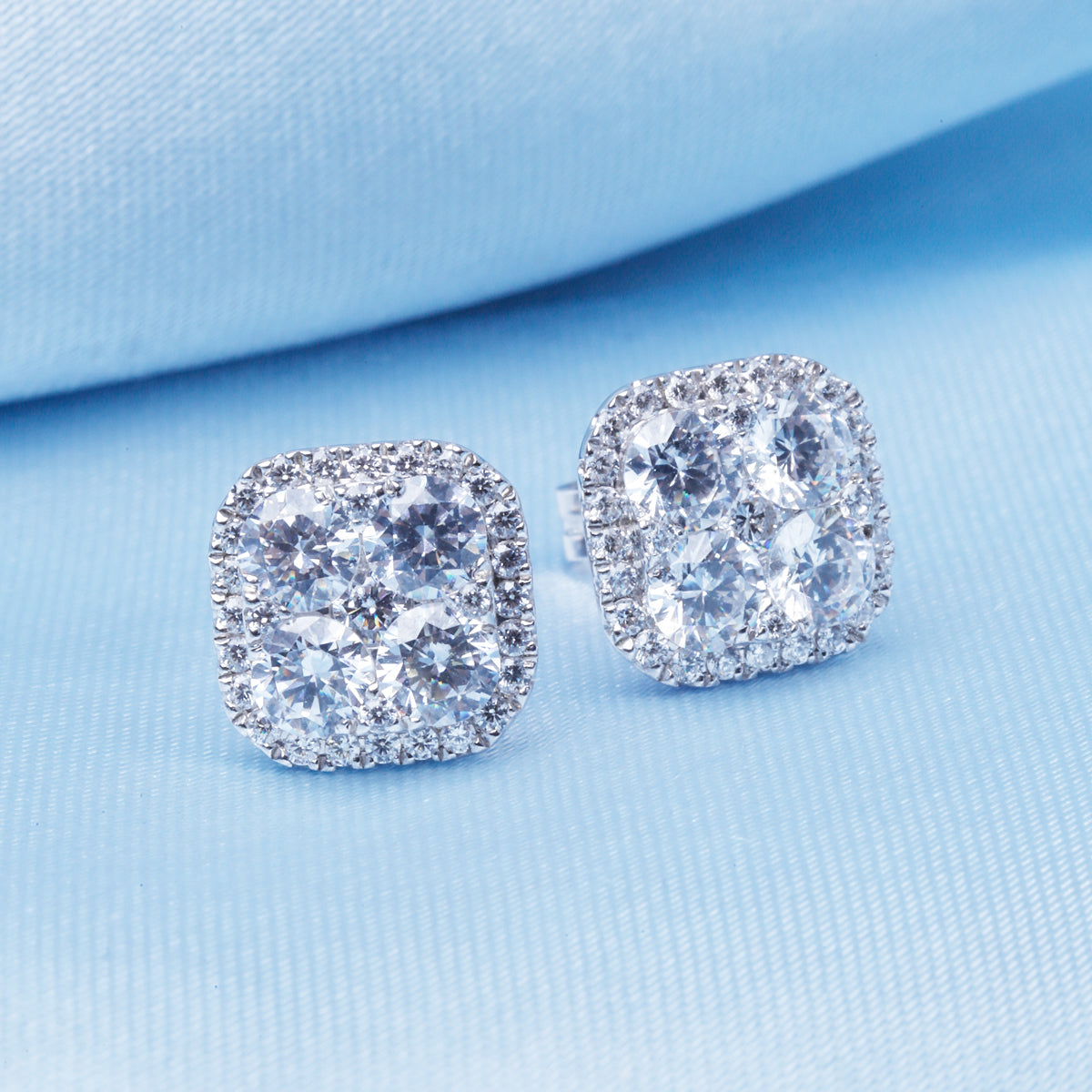 Diamond Cluster stud earrings set with four sparkling round diamonds. Elegant for timeless beauty