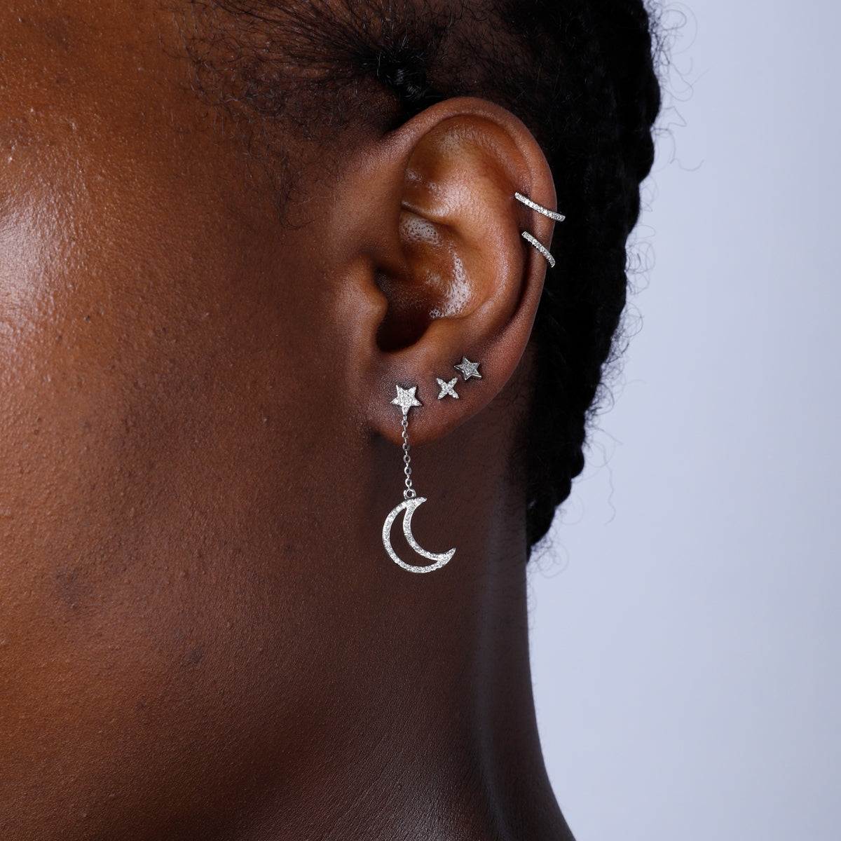 Diamond Dangle Earring showcasing a crescent. Capturing majestic allure with embellished diamonds