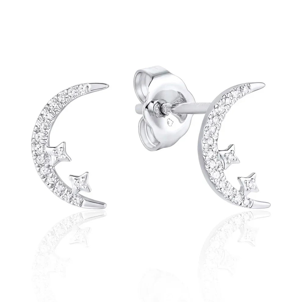 Diamond moon studs with shiny diamonds to elevate the added star design. 