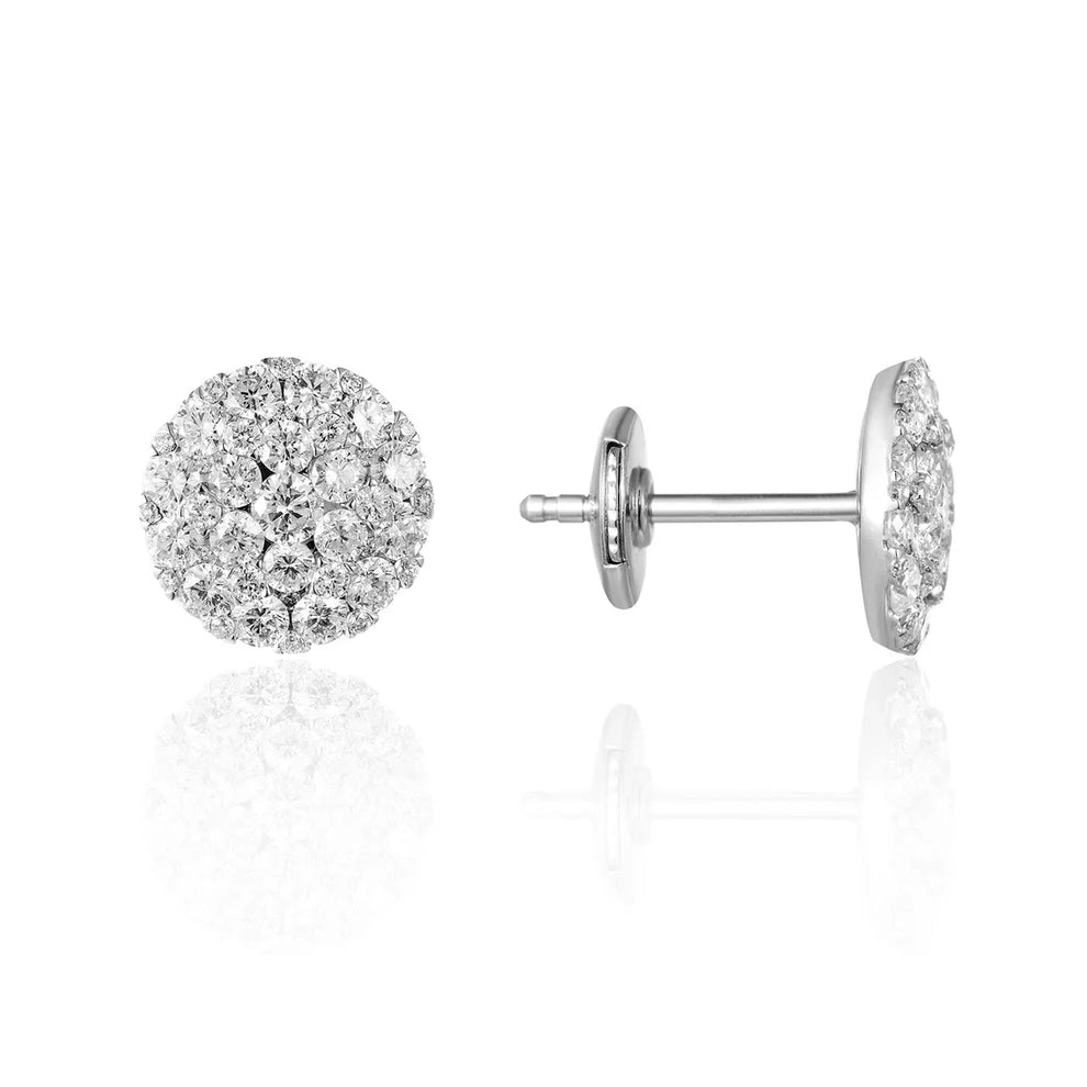 Cluster earrings feature a classic round diamond shape, held together with a platinum prong setting.