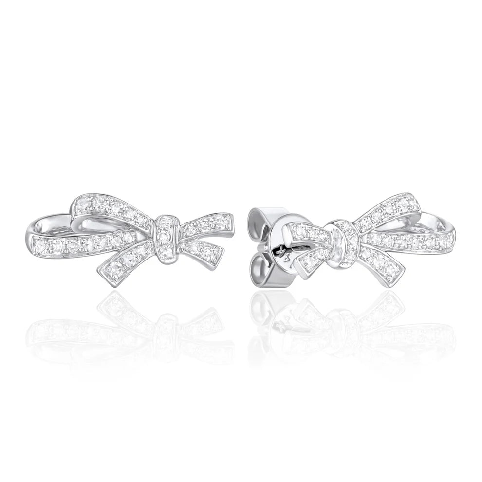 Diamond bow studs with pave set round diamonds. Crafted with fine details of intertwined bows.