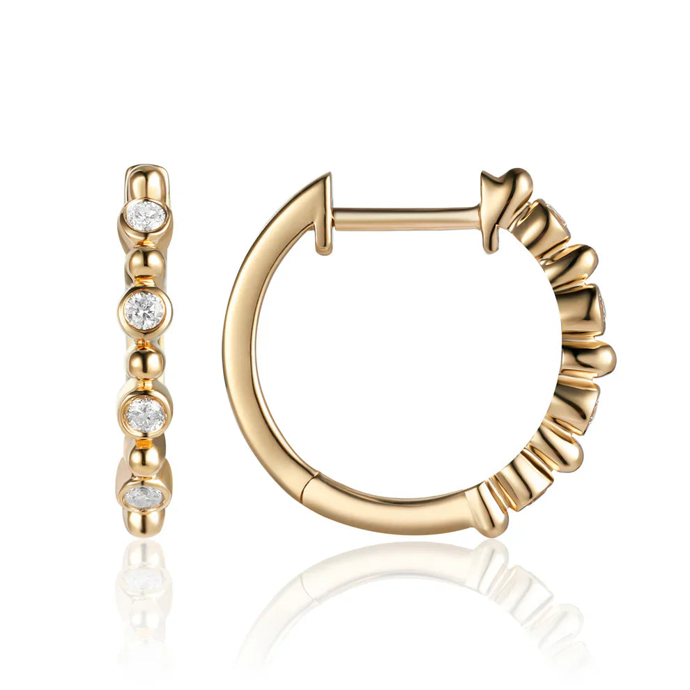 Bethany Diamond Hoop crafted in gold and adorned with round diamonds to create a simplistic pattern.