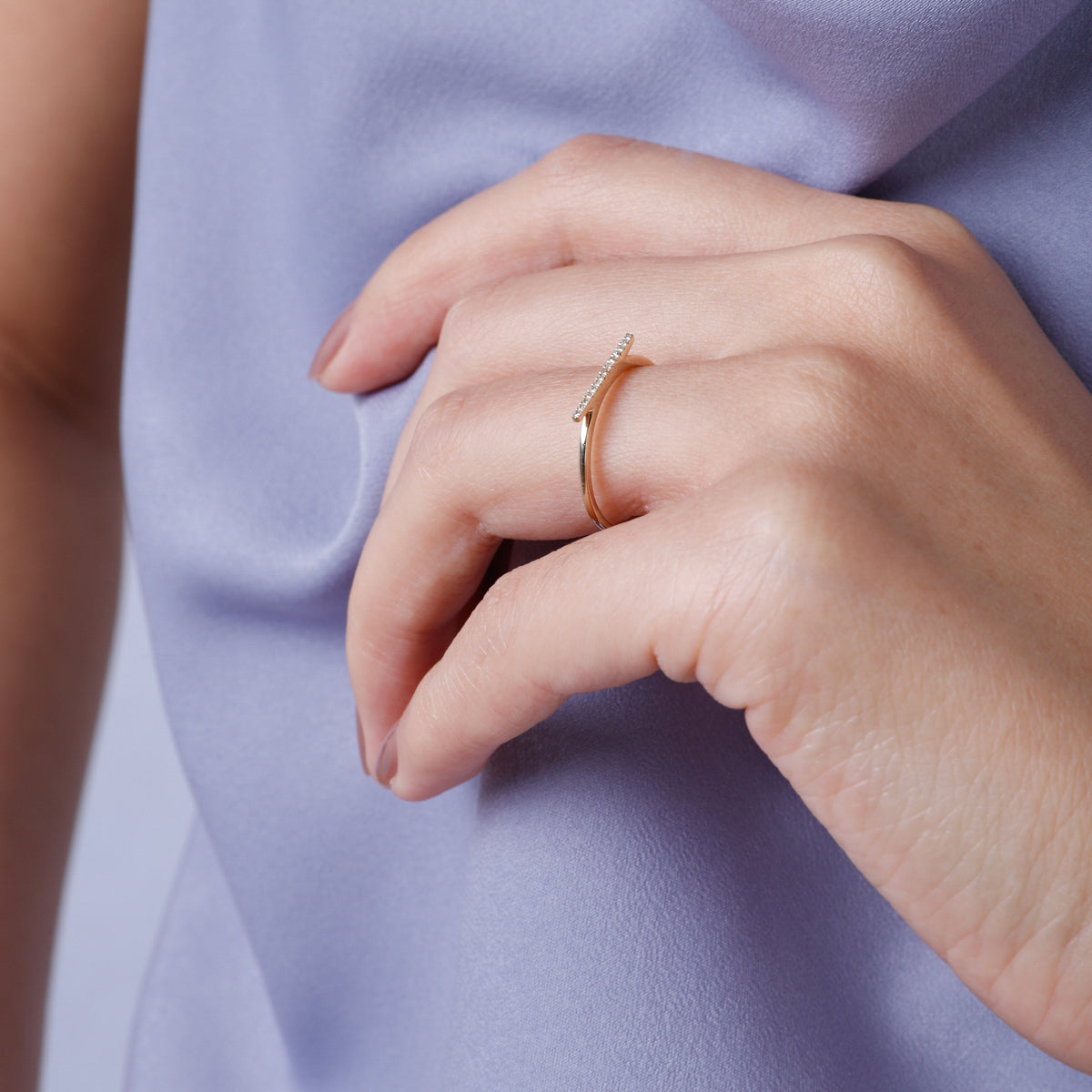 Crafted with sleek sophistication. Golden bar of alluring diamonds, showcased in polished 14K ring.