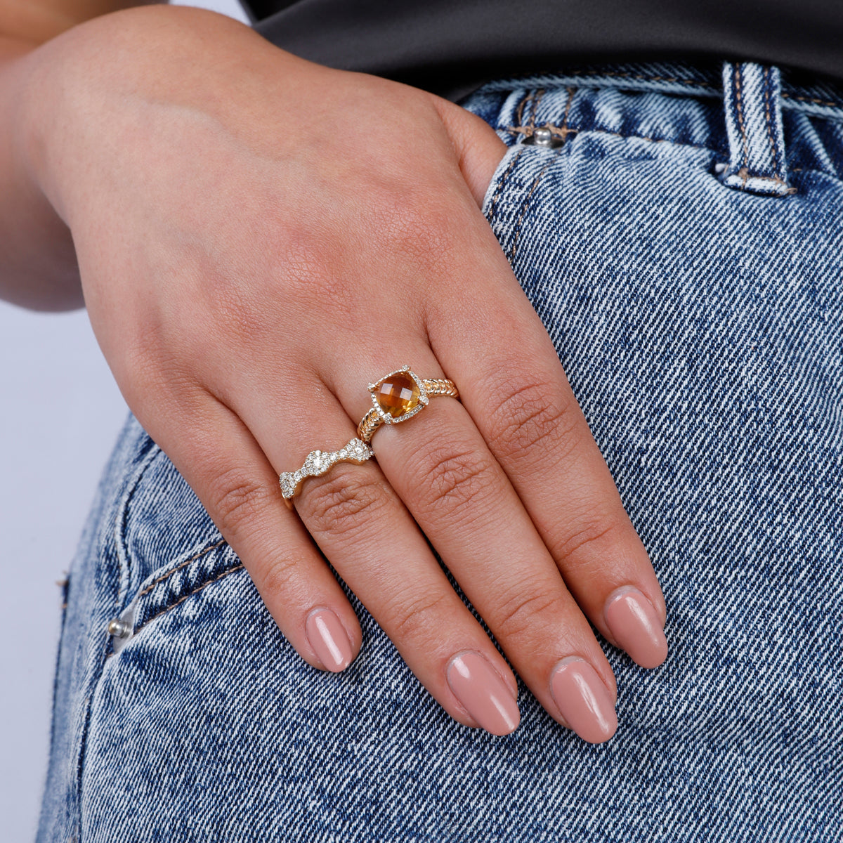 Braided Halo Ring, gemstone with a golden braided band symbolizing unity and strength. Modern twist.