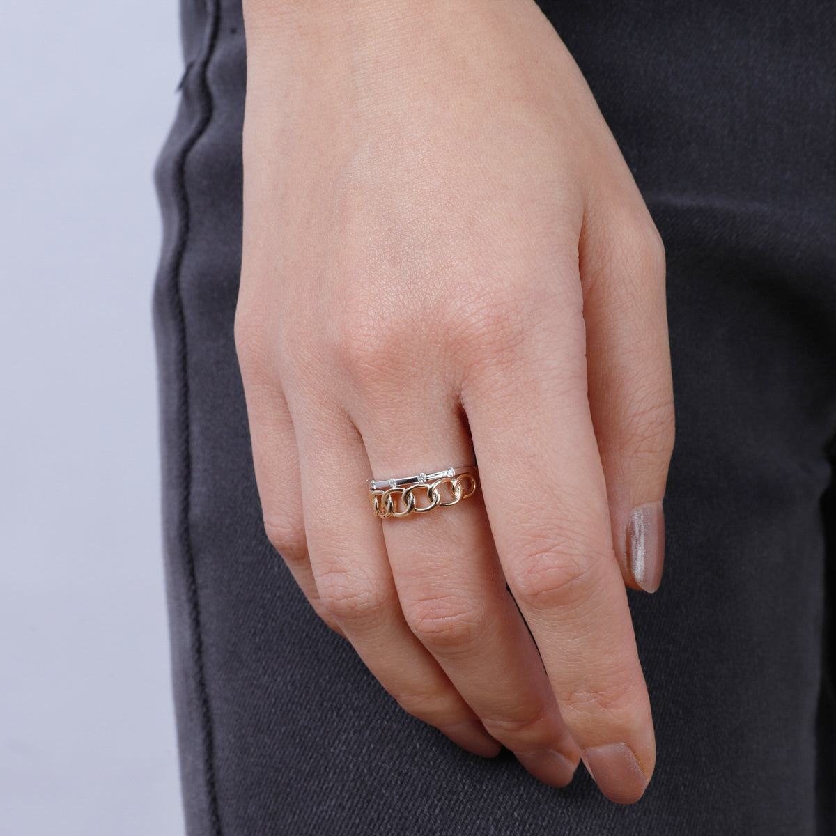 Diamond bar and interlocking chain ring encrusted with glittering diamonds. 