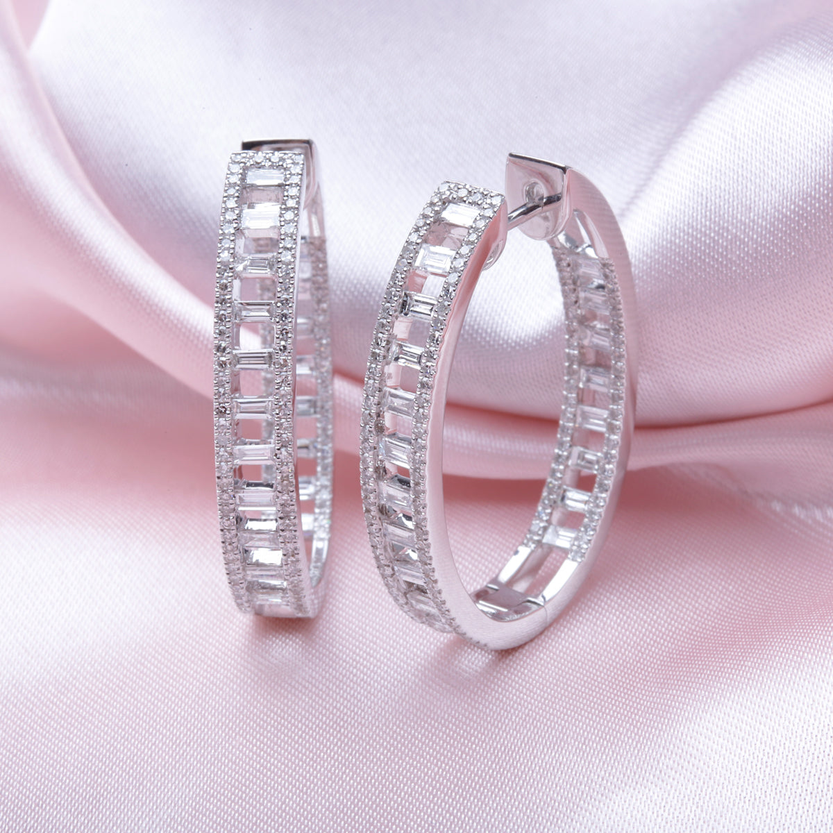 14k diamond hoops with a baguette cute design. Small diamonds around the hoop for a stylish look. 