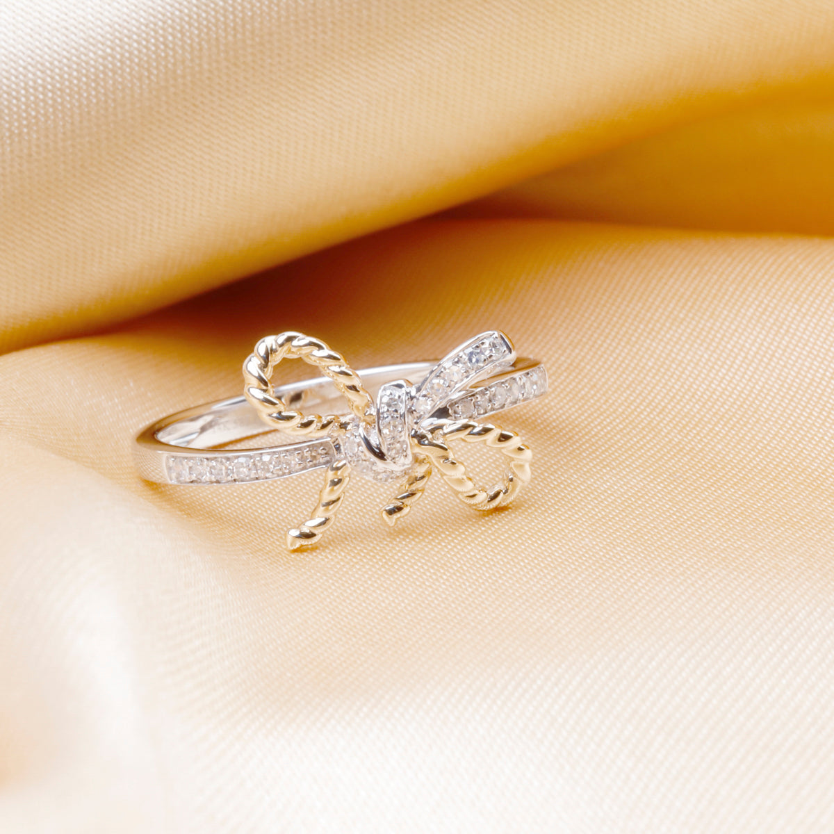 Bow Rope Ring is a timeless piece that has a distinctive bow-shaped with a  diamond in its center.