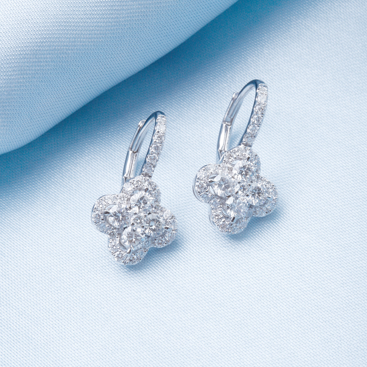 Handcrafted earrings with diamonds in a stunning cluster design. 