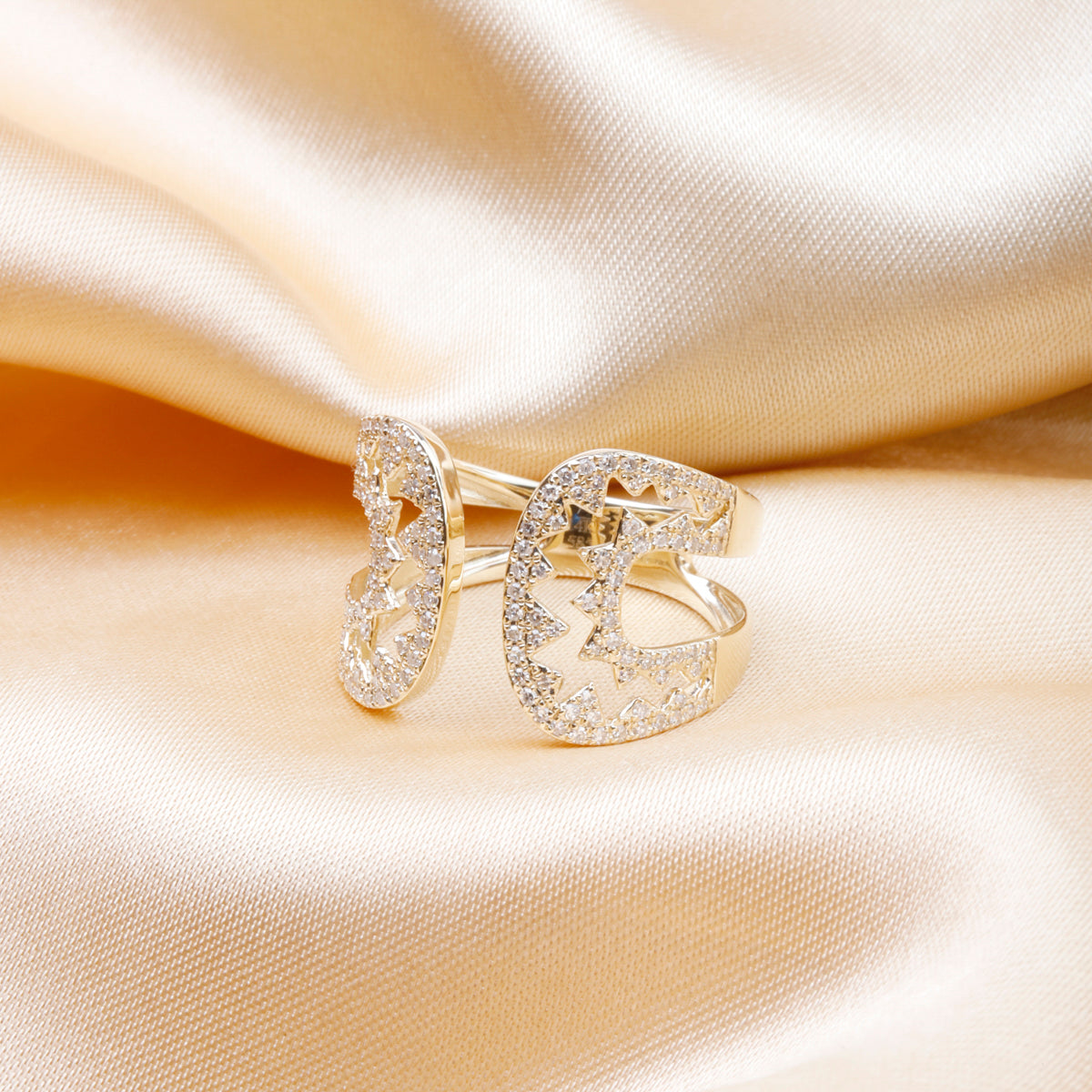 Perfect balance of contemporary & sophistication with geometric open design. Embezzled with diamonds