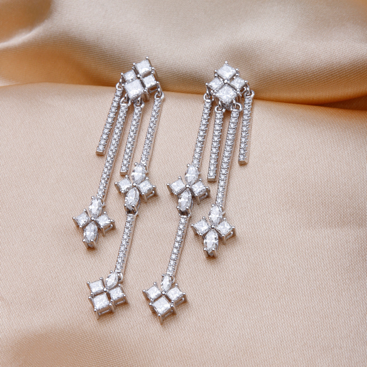 Inspired Chandelier Earrings feature a  cascade of diamonds that will glisten and illuminate.
