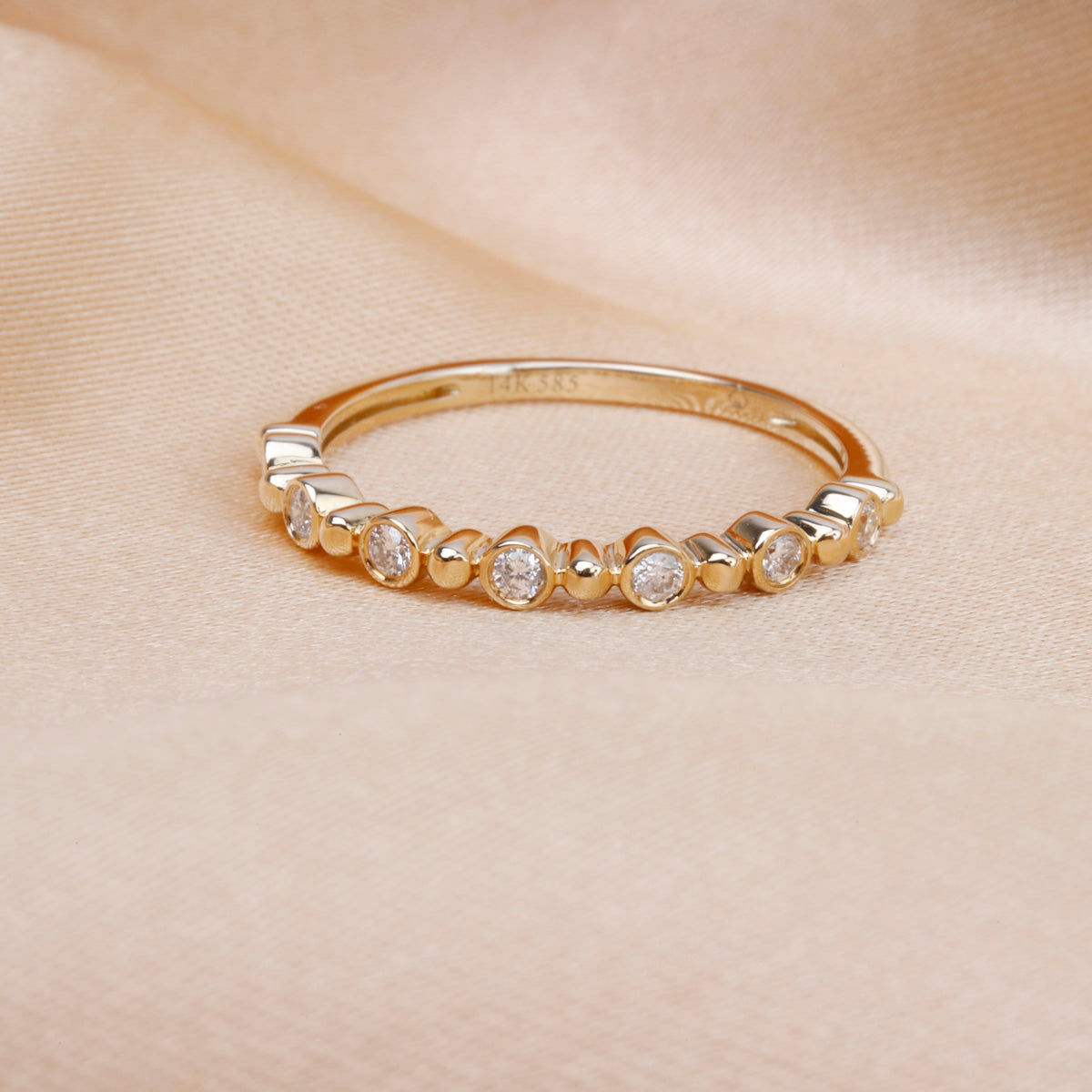 Bethany Ring is a perfect dainty ring to elevate your stack. Crafted with accents of round diamonds