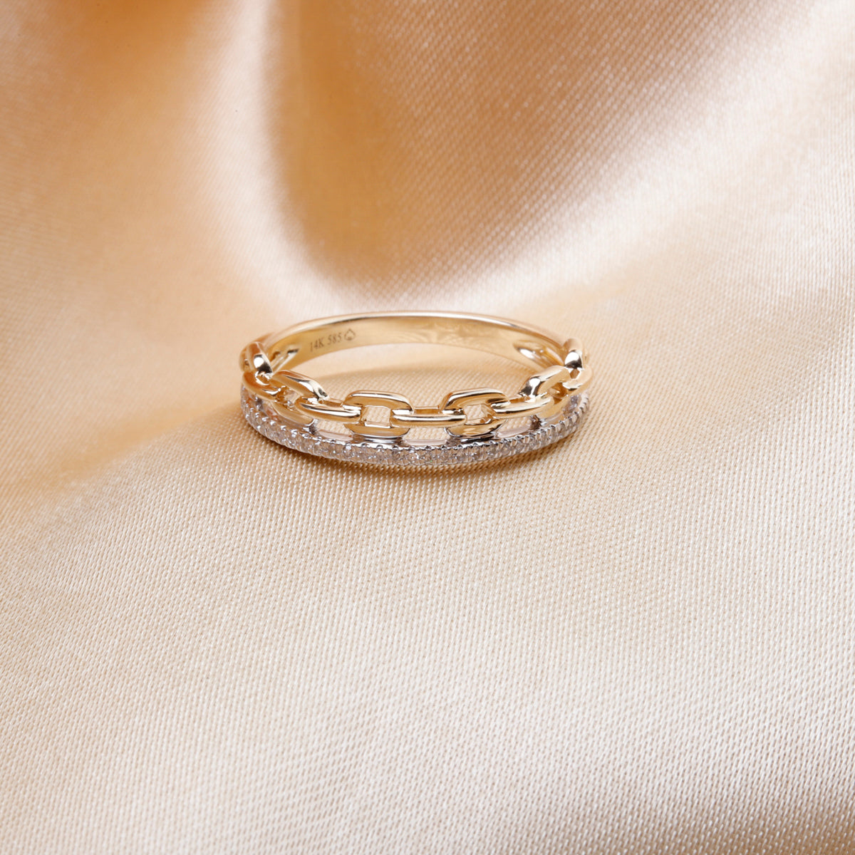 Featuring a diamond at the center, accented by dazzling bar settings and linked to an elegant chain.