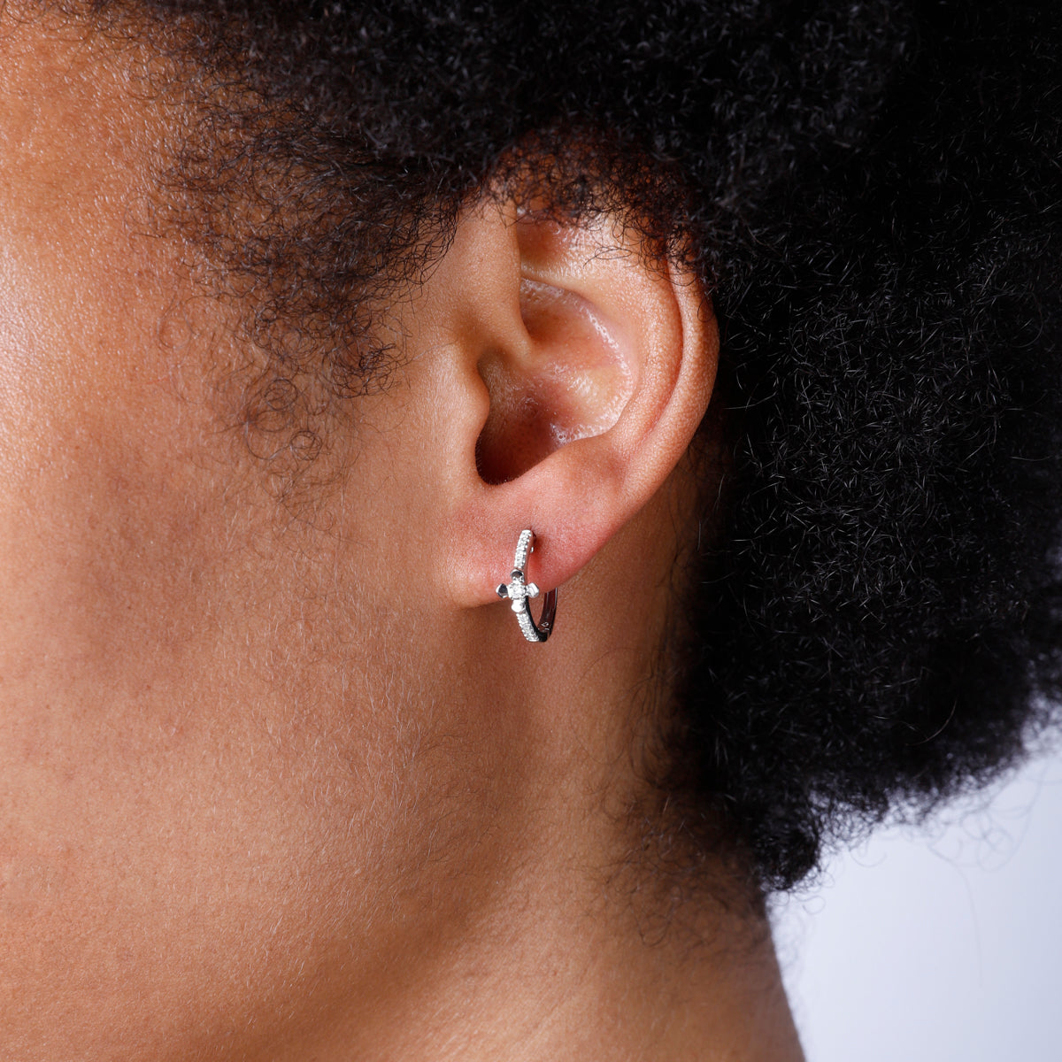 Classic hoops with cross pave design. The intricate design makes for an eye-catching touch