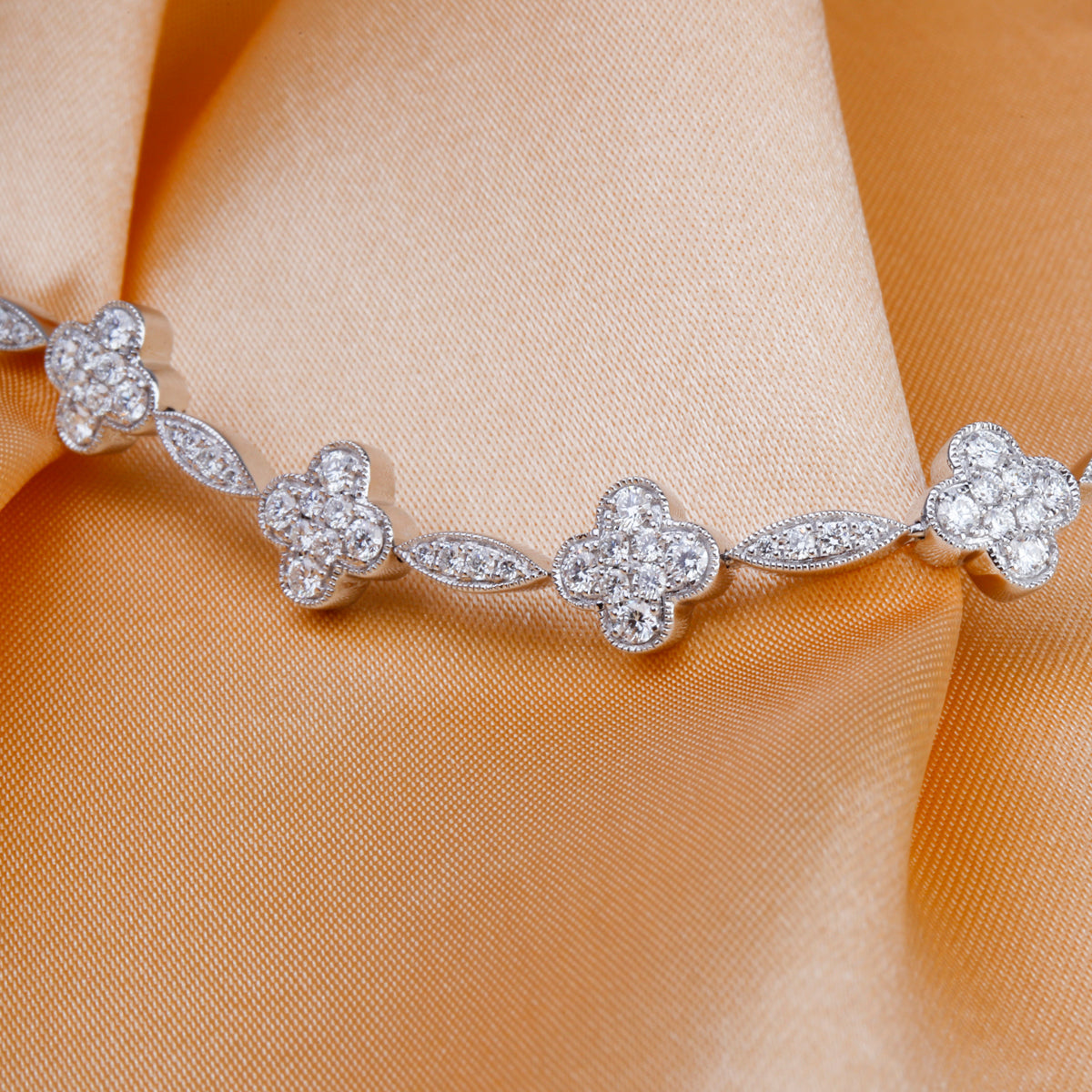 Clover link bracelet with dazzling diamonds in each inspired clover. Link design for timeless allure