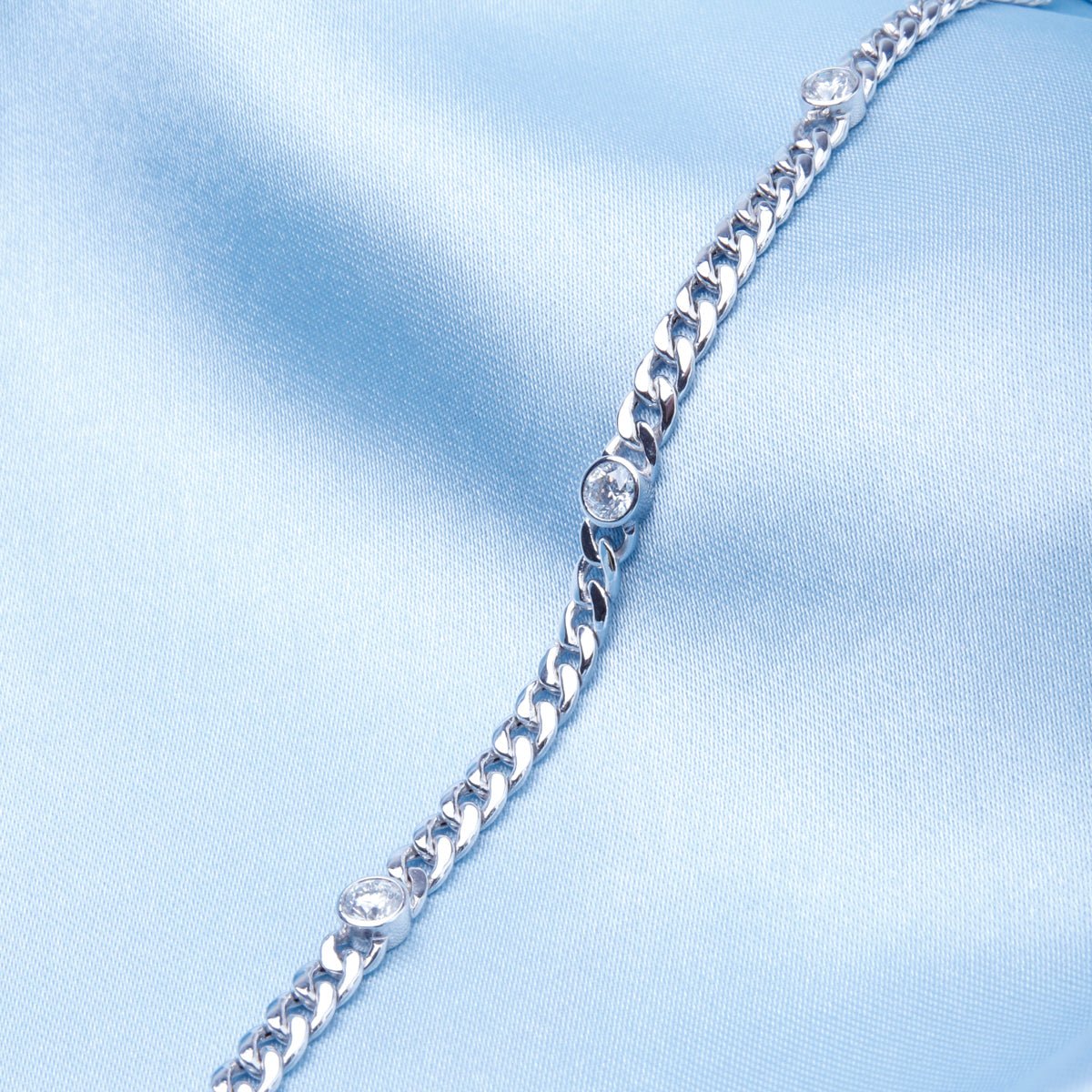 Diamond chain bracelet is a timeless piece made with a high polish finish and bezel design.