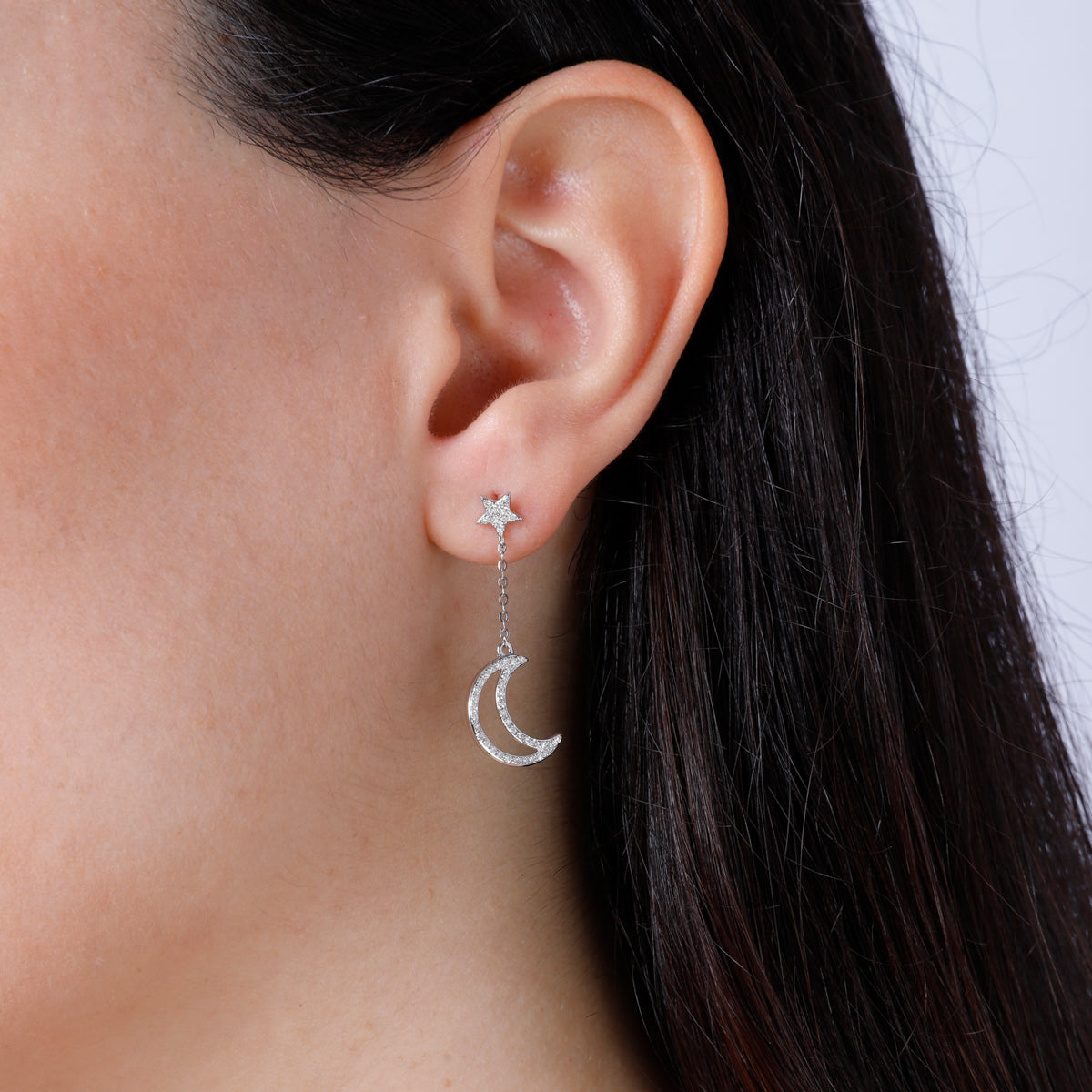 Diamond Dangle Earring showcasing a crescent. Capturing majestic allure with embellished diamonds