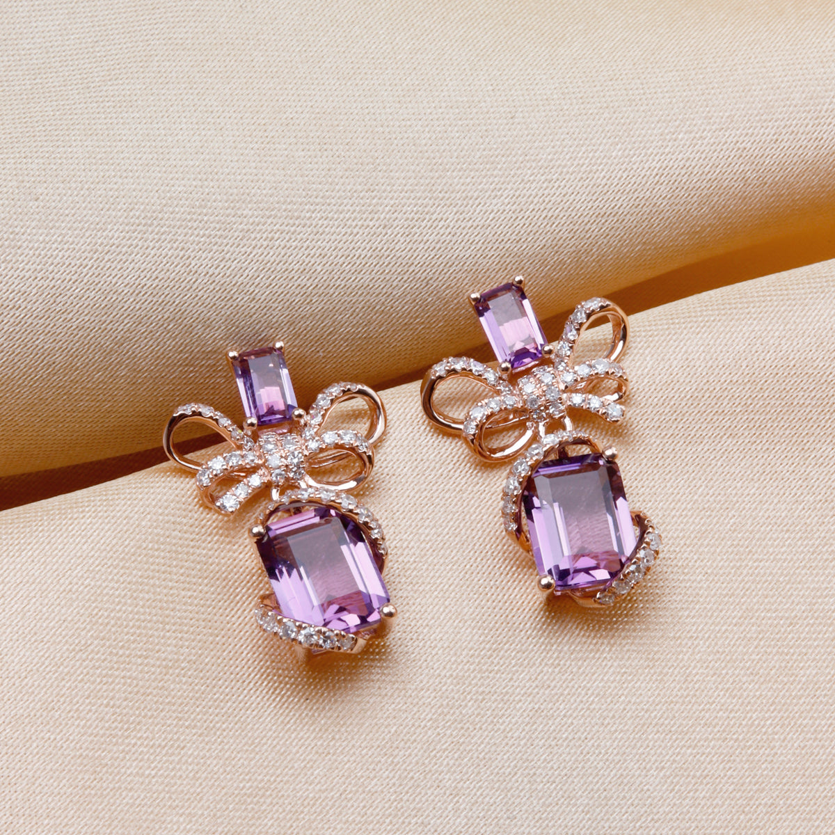 Bow Wrap Drop Earrings with radiant gemstones. Bows with glimmering diamonds and variety of gems. 