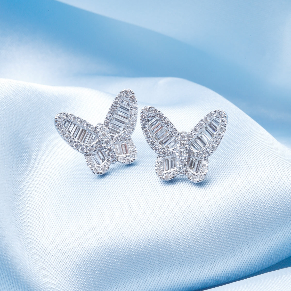 Elegant butterfly studs, their unique shape-baguette diamonds will spark at every angle.