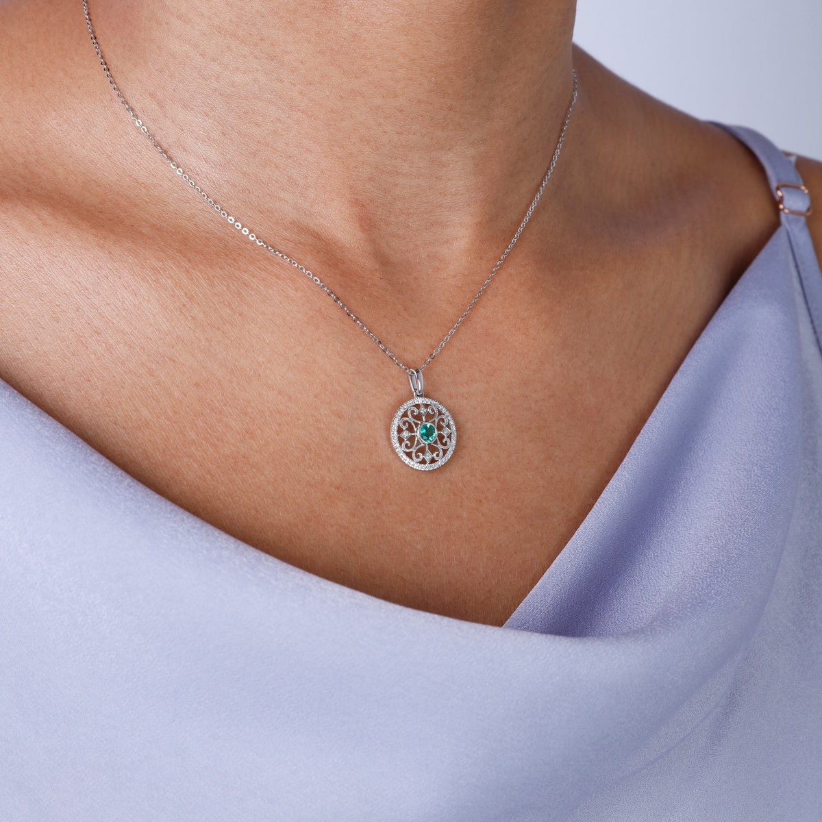 Classic necklace with a modern twist. Center precious stone with mesmerizing surrounding & diamonds