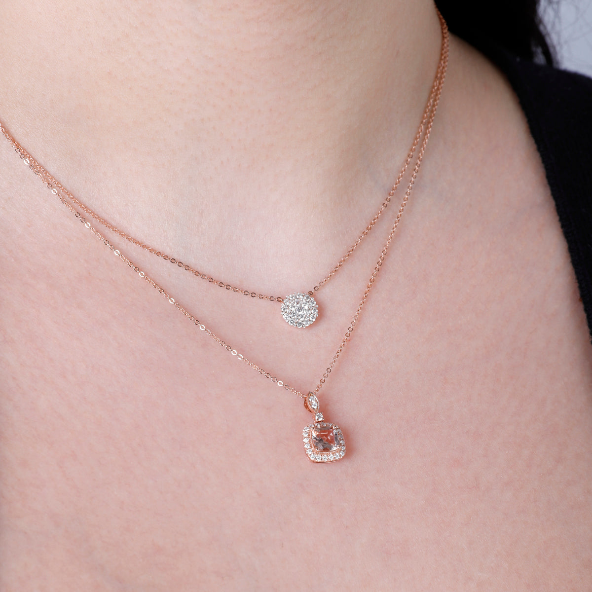 Cushion Cut Necklace displaying an intricate arrangement of diamonds and a center precious stone