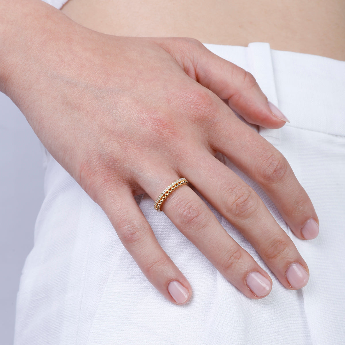 Romantic ring features a bar of diamonds stacked on a beaded bar. Make a statement of elegance.