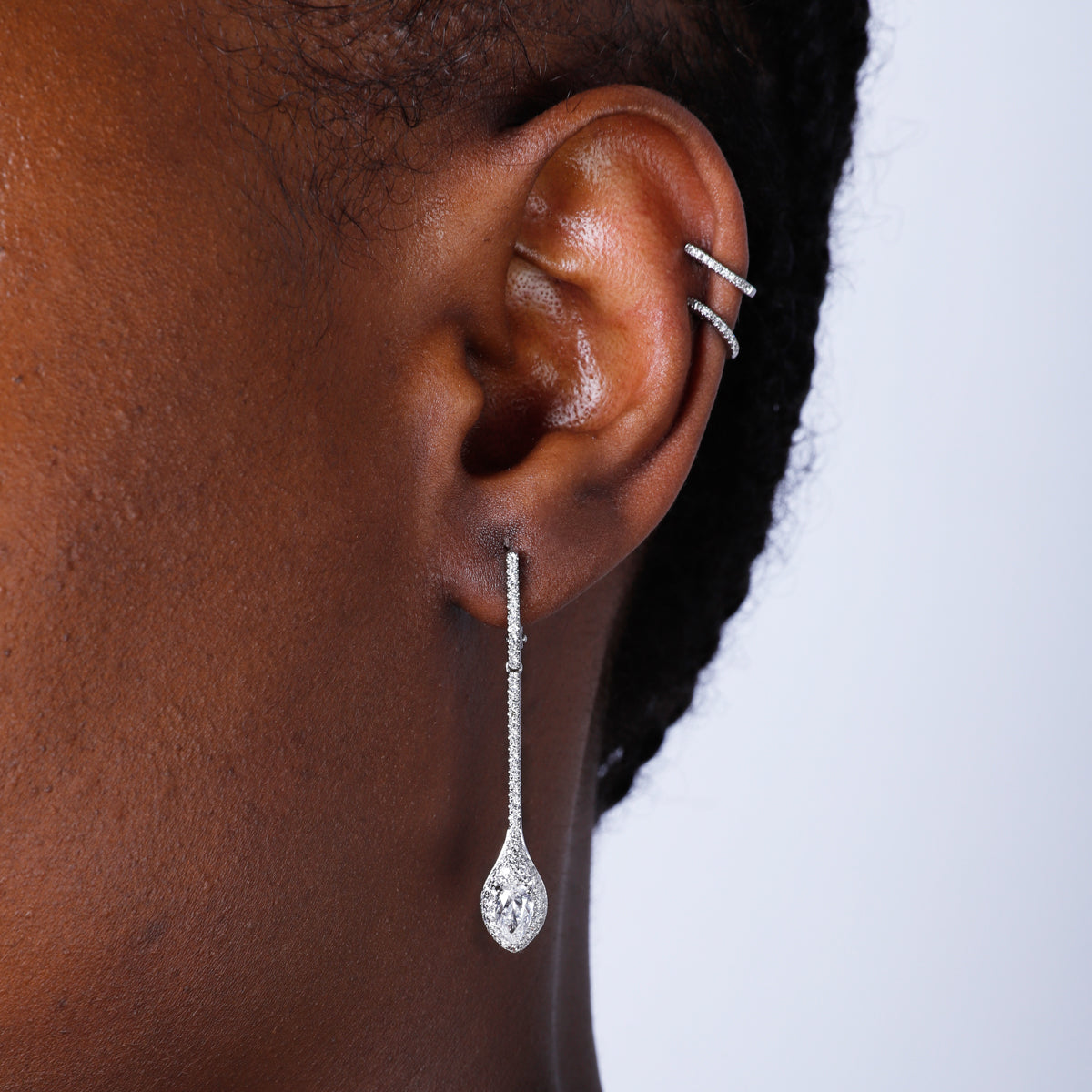 18k Diamond Drop Earrings with a pave setting enhancing the center diamond to stand out. 