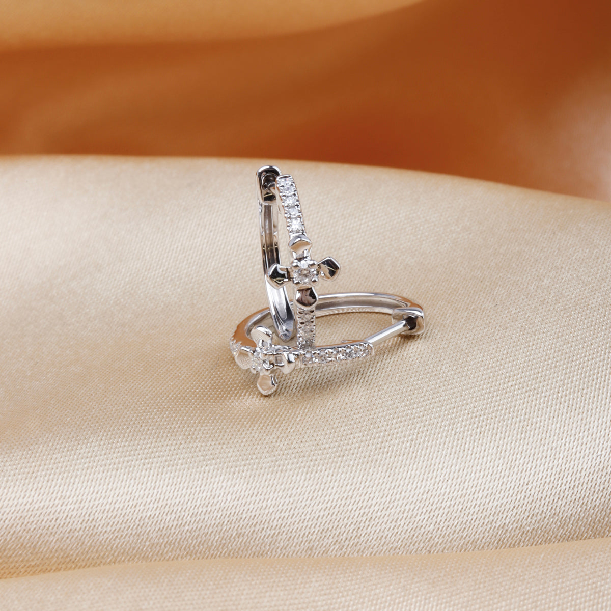 Classic hoops with cross pave design. The intricate design makes for an eye-catching touch