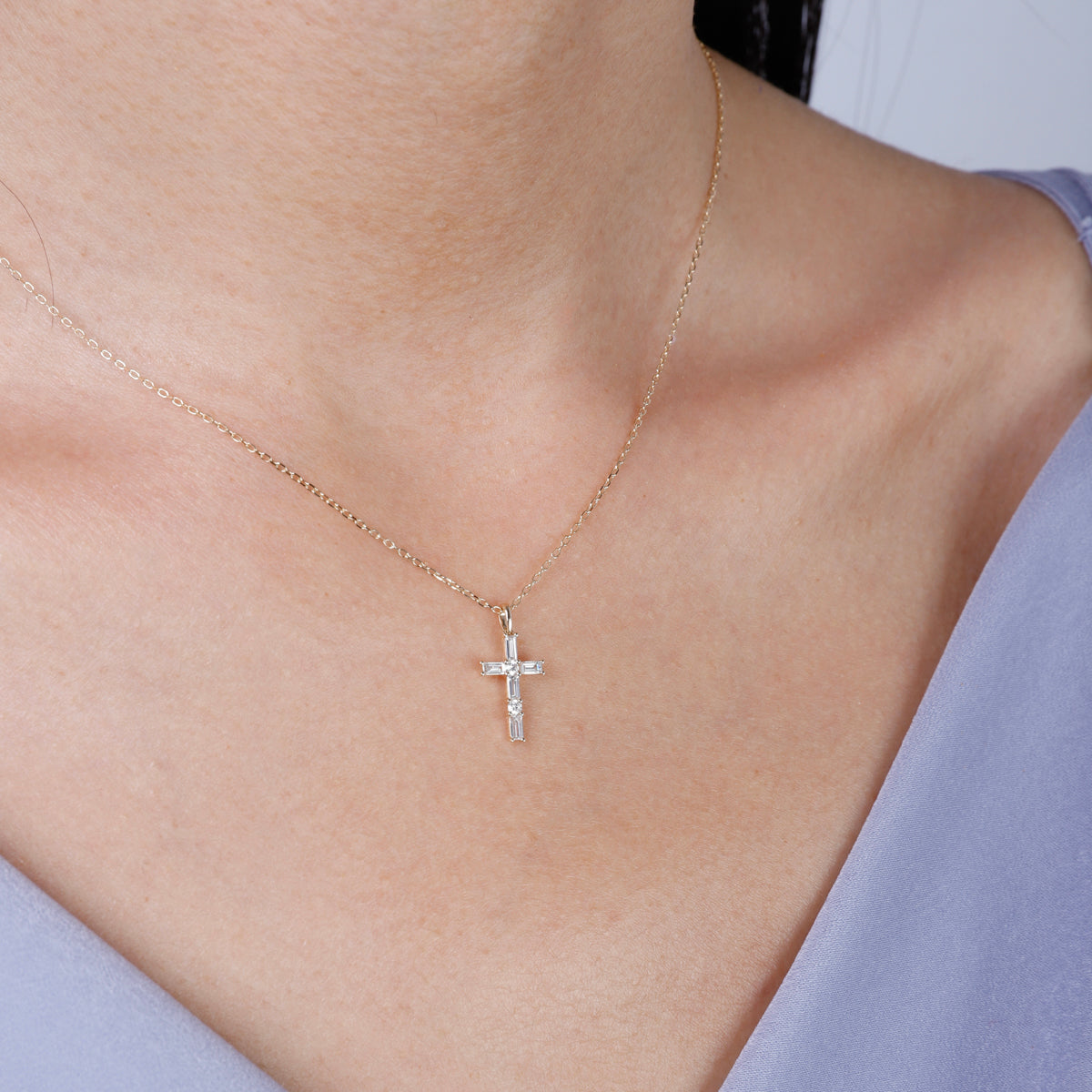 14k Baguette Diamond Cross crafted to captivate. Encrusted with shimmering baguette diamonds.