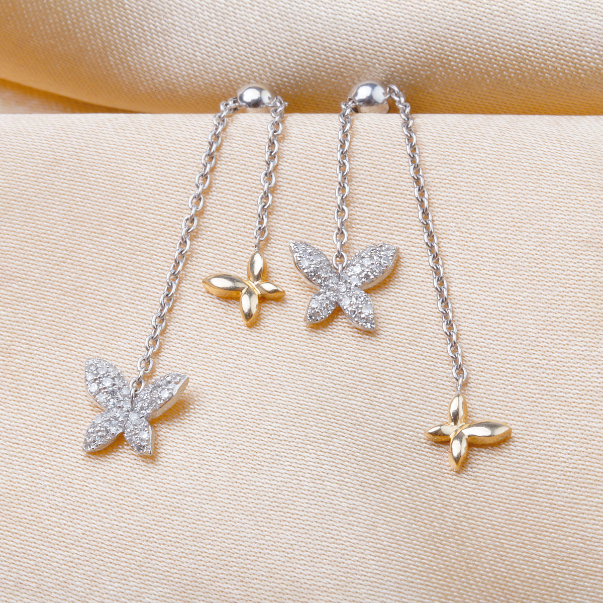 Butterfly Chain Earrings with delicate chains and butterflies, creating a sense of wonder and beauty