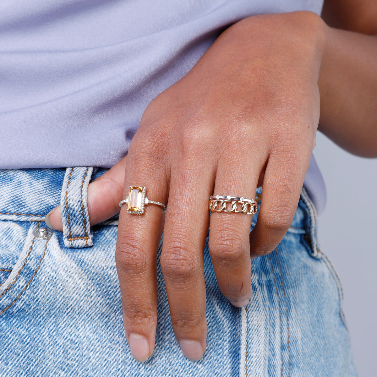 Diamond bar and interlocking chain ring encrusted with glittering diamonds. 