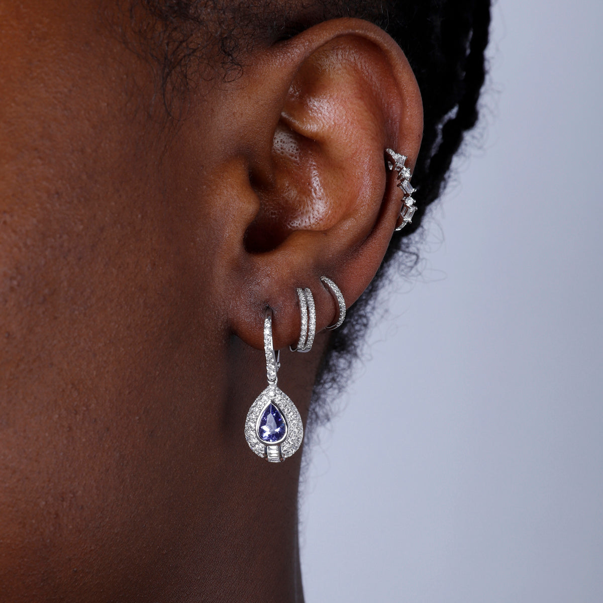 Precious stone teardrop cut earrings surrounded by a diamond halo. Effortless beauty for everyday