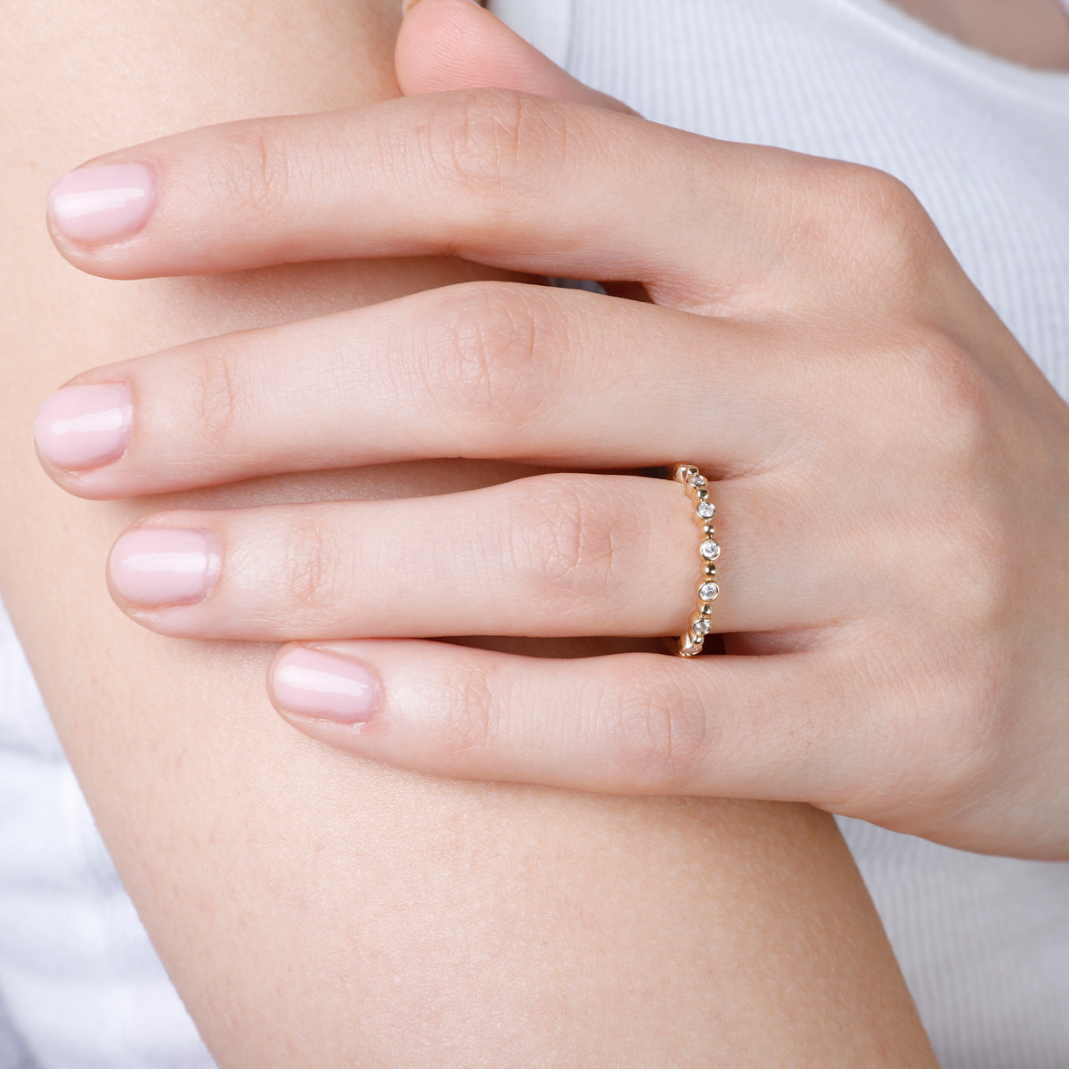 Bethany Ring is a perfect dainty ring to elevate your stack. Crafted with accents of round diamonds