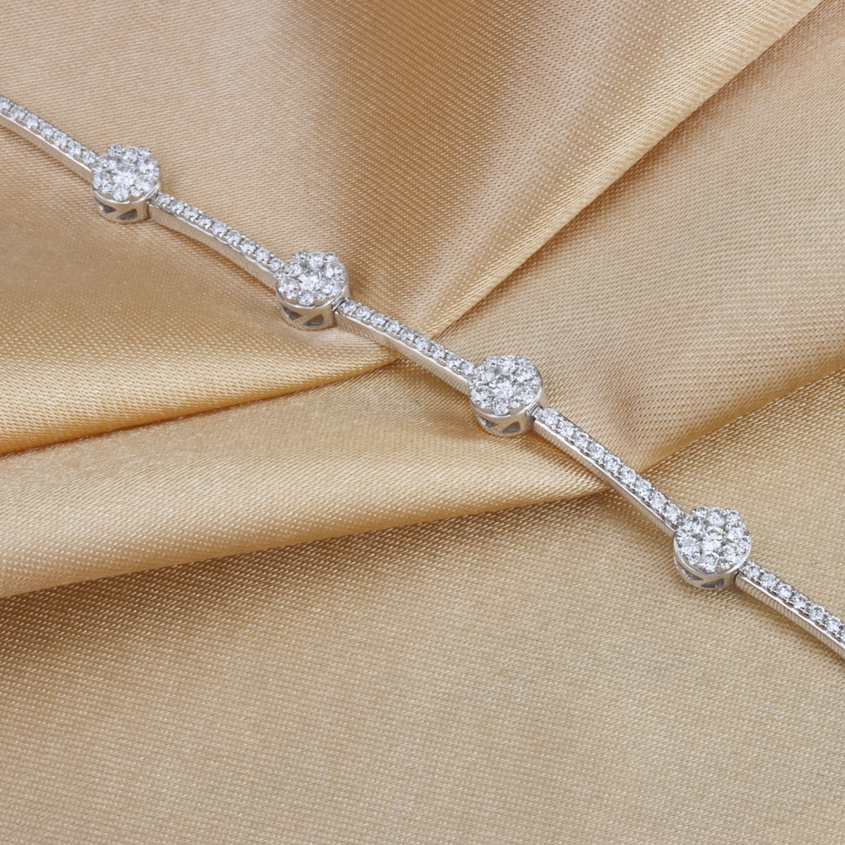 Gold bracelet is a classy and trendy. The alternating cluster pavé diamonds are a timeless design