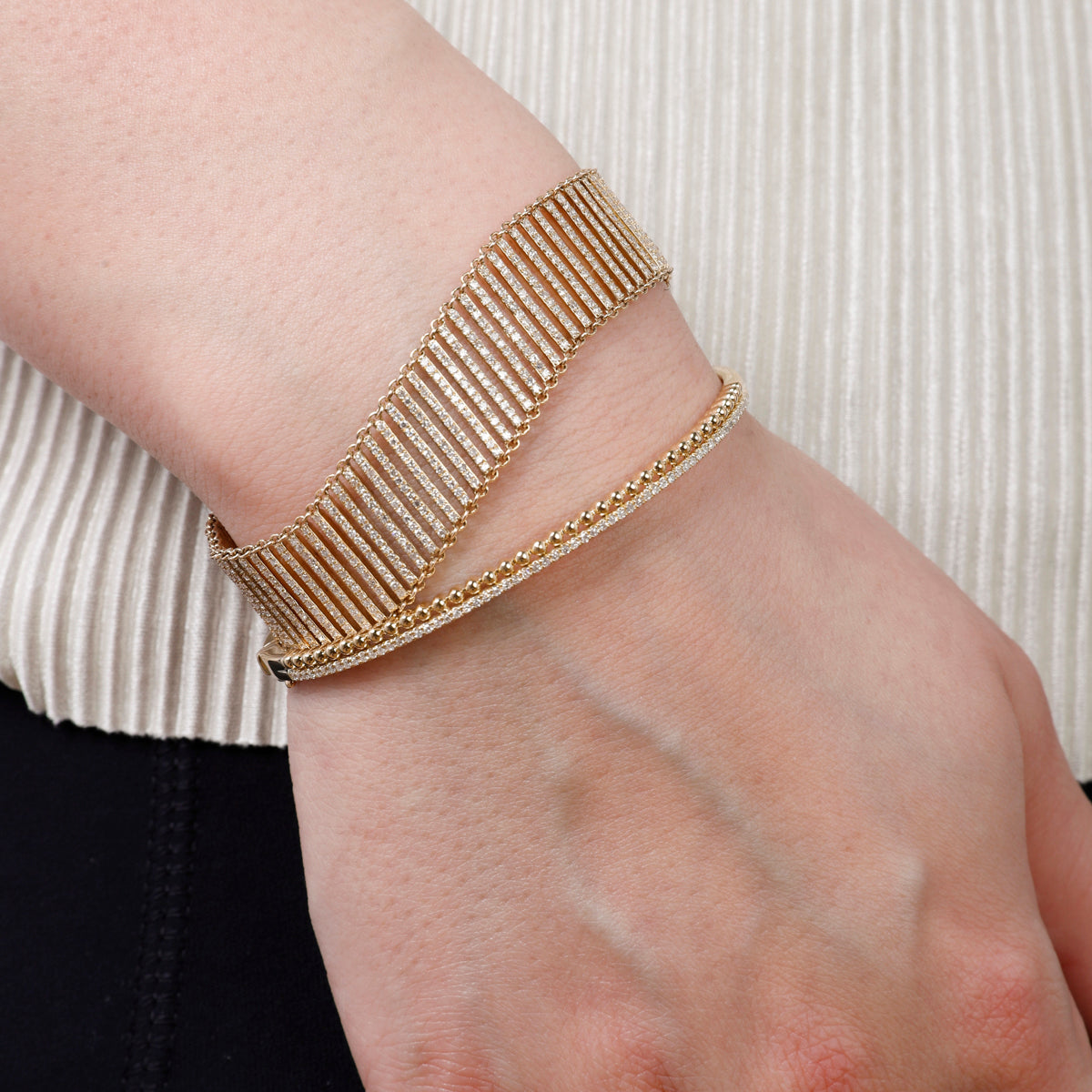 Beaded Gold Bangle features beaded accents that radiate classic charm. Add a touch of sophistication