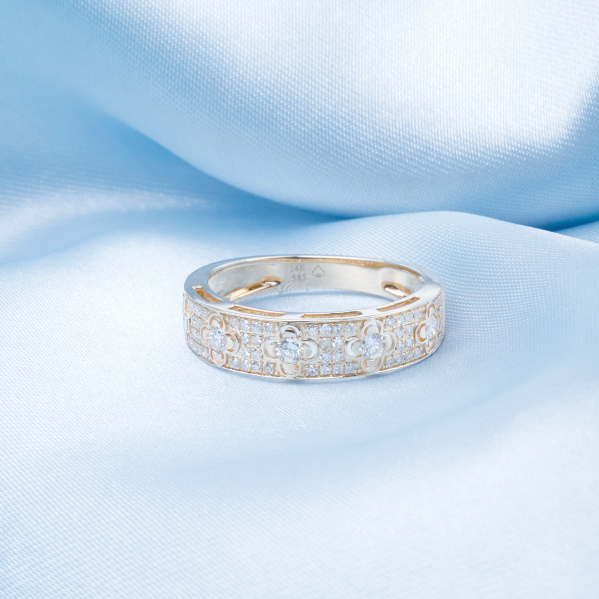 Clover Pave Ring features a delicate four-leaf clover dome design adorned with a paves diamonds