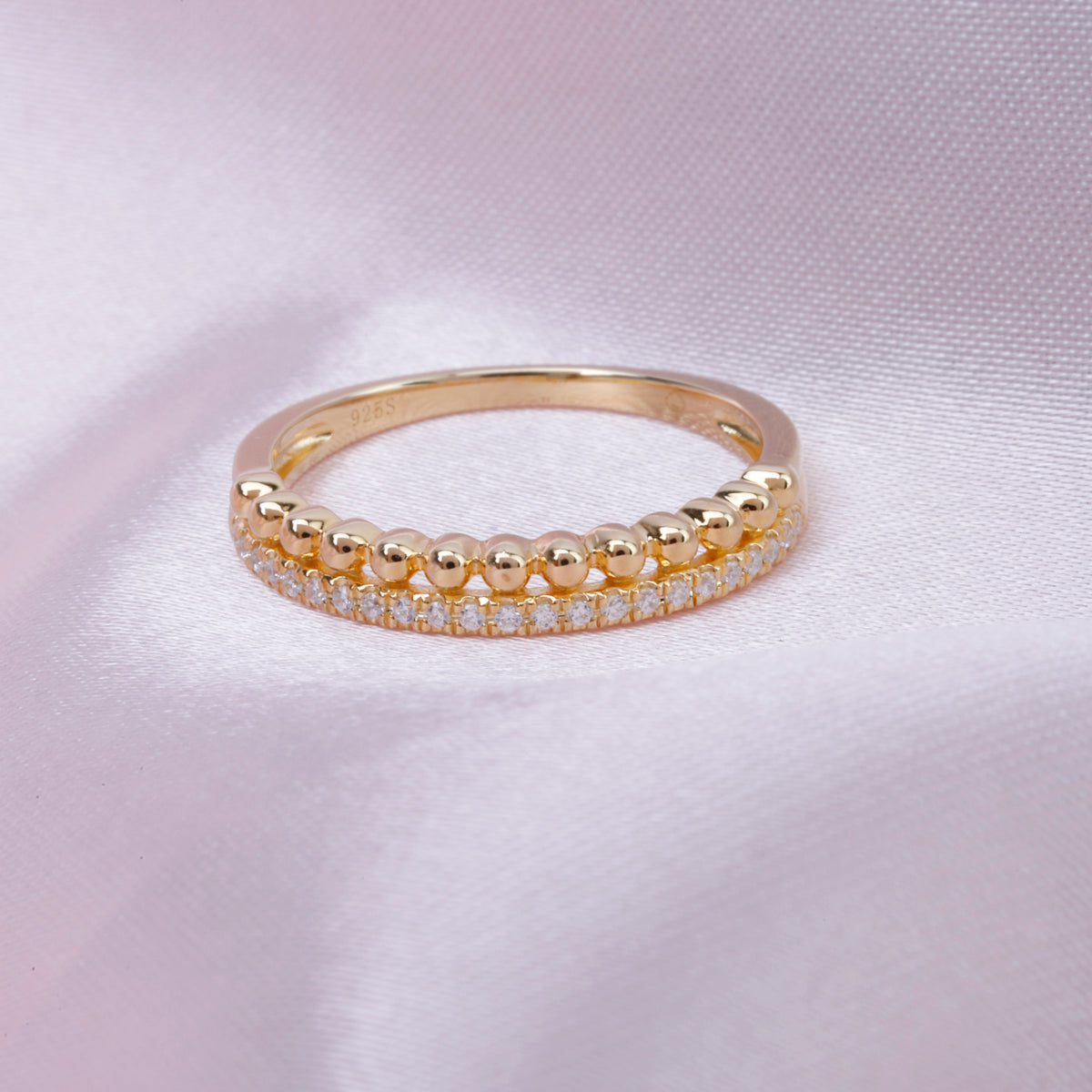 Romantic ring features a bar of diamonds stacked on a beaded bar. Make a statement of elegance.
