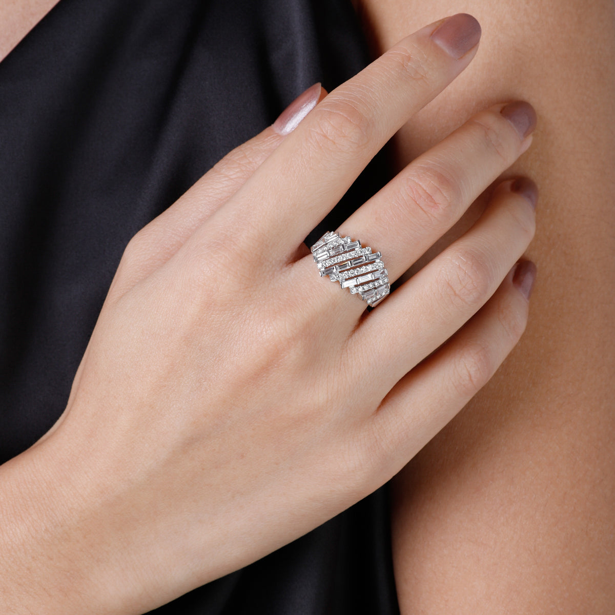 14k baguette statement ring, embellished with dazzling diamonds encircling the elegant baguettes.