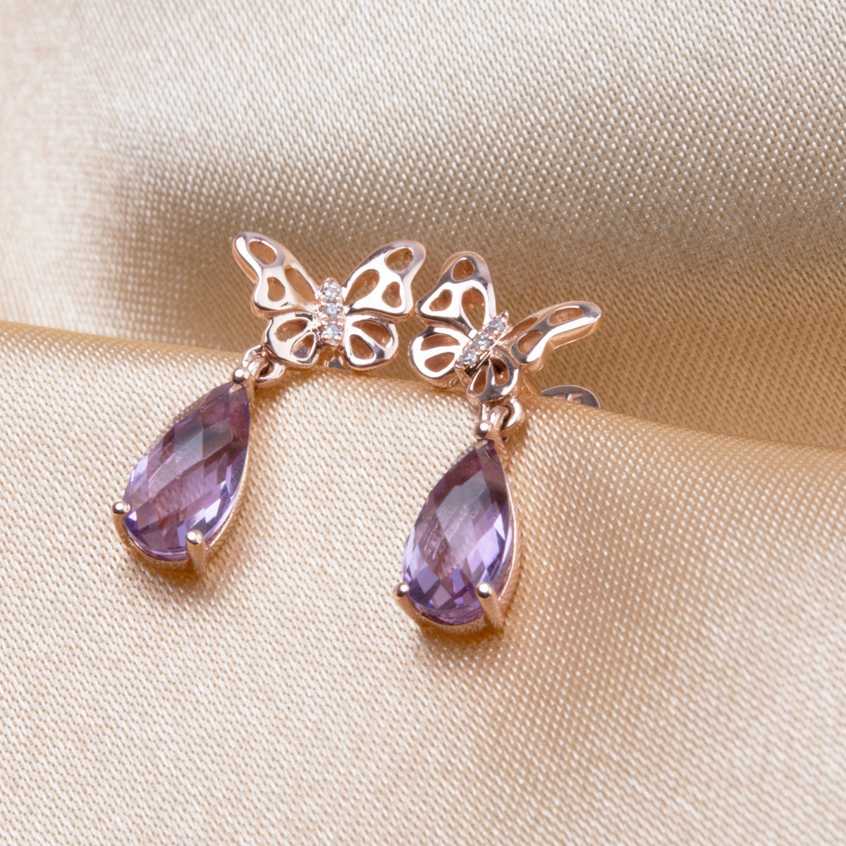 Unique butterfly design with diamonds & mix of gemstones for a subtle pop of color. Timeless beauty.
