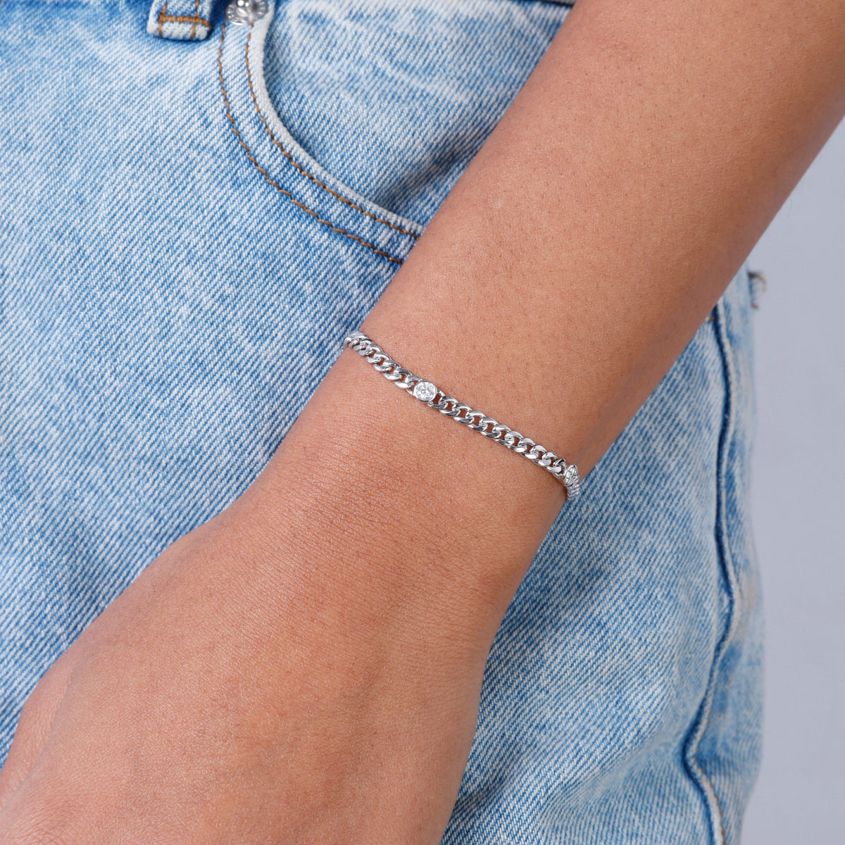 Diamond chain bracelet is a timeless piece made with a high polish finish and bezel design.